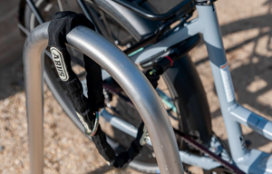 ABUS Frame Lock Chain attached to the frame lock on a CERO bike and wrapped around a bike rack